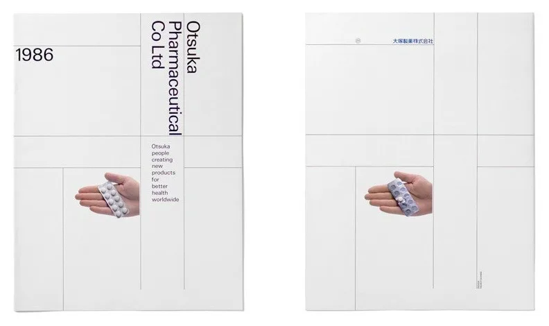 Front and back of a 1986 Otsuka Pharmaceutical brochure: pale pages ruled in thin lines, the company name set sideways in a light sans, and a hand holding a blister pack of tablets.